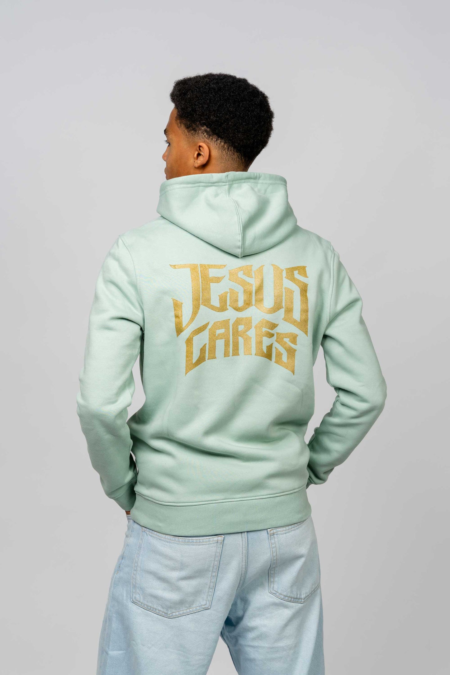 JESUS CARES SAGE HOODIE GOLD CURVED PRINT